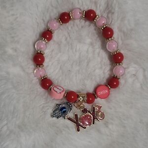 Red and Pink Beaded Bracelet with Charms